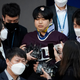 Cho Ju-bin, leader of South Korea’s online sexual blackmail ring which is so called “Nth room,” is surrounded by journalists while walking out of a police station as he is transferred to prosecutors’ office for further investigation in Seoul, South Korea, Wednesday, March 25, 2020.